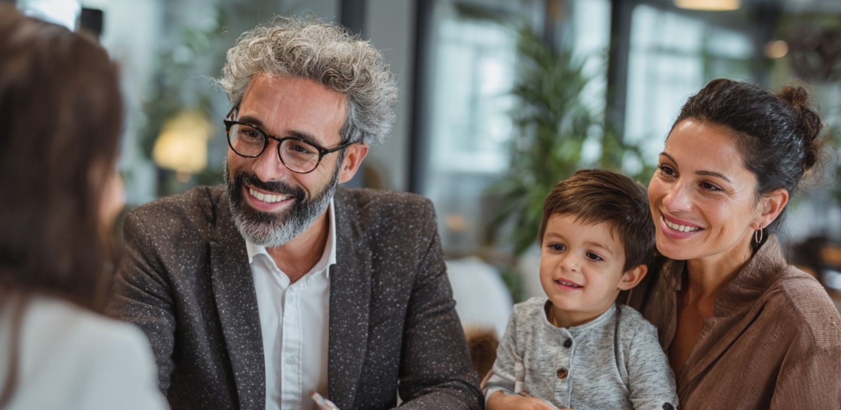 family adoption attorney Adoption attorney meeting with parents and child to talk with adoption agencies and other parties during the adoption process.